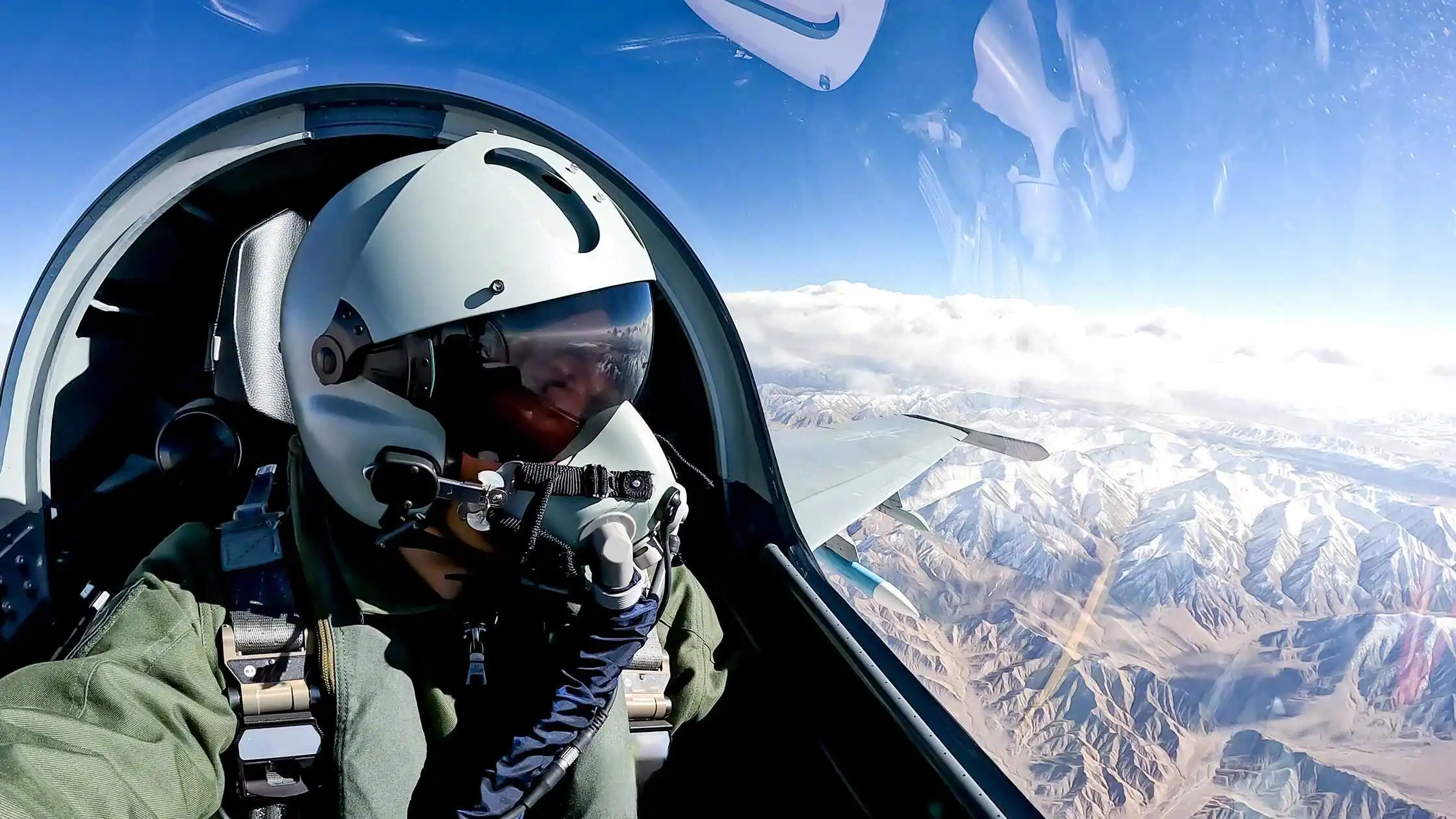 Air Force fighter jets and snow-capped mountains